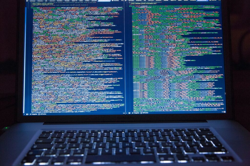 Laptop screen showing software code during a system update