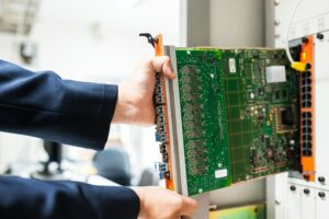 Engineer fixing a core switch in a data center room